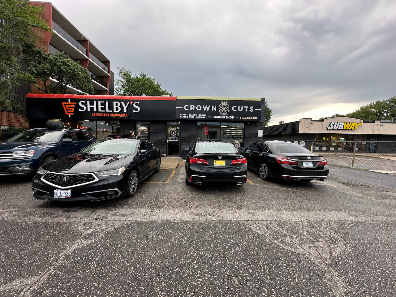 Two Acura TLXs and a 9th generation Honda Accord parked in front of restaurant.