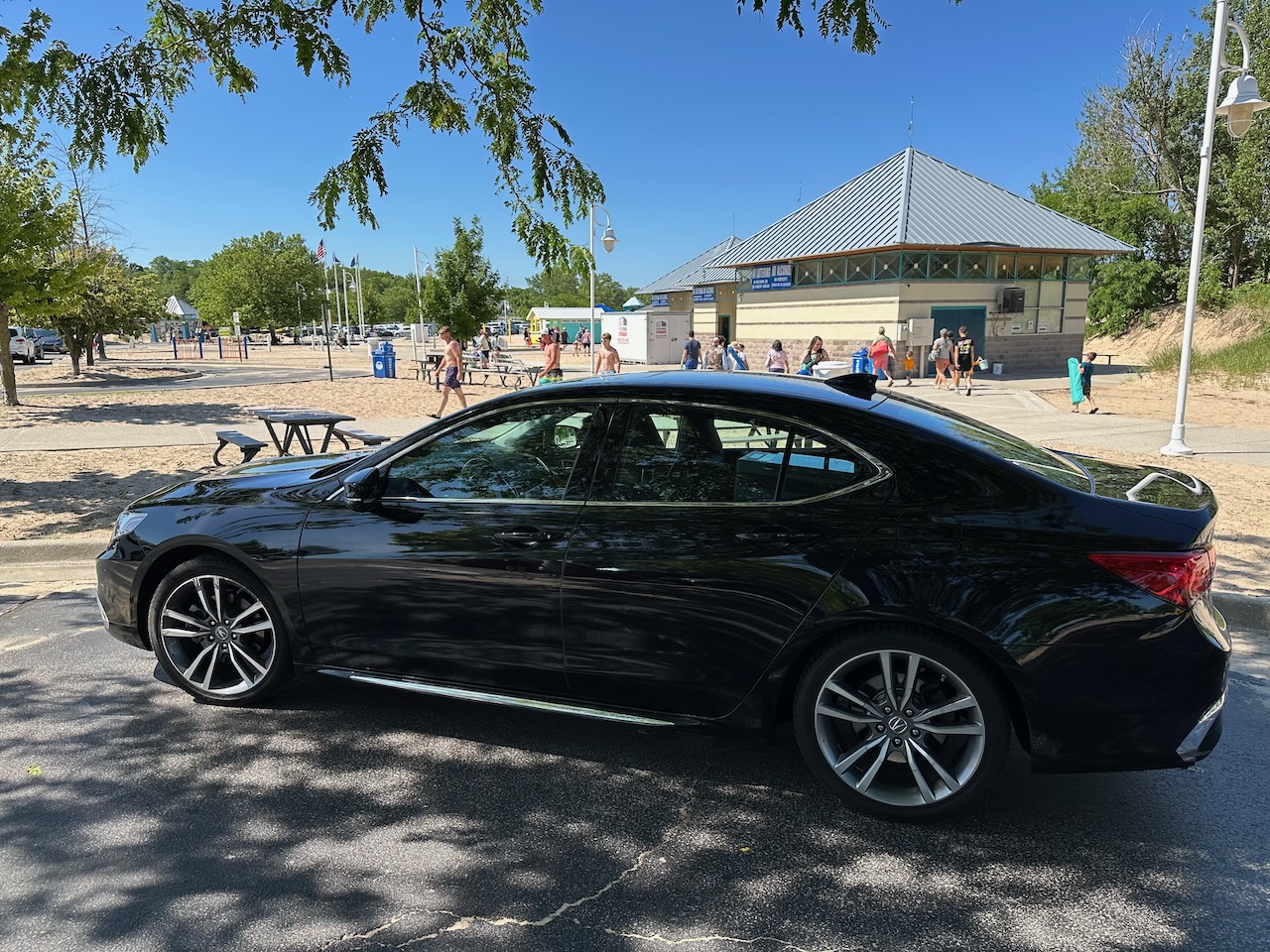 2020 Acura TLX parked in front of bathhouse at Silver Beach. 