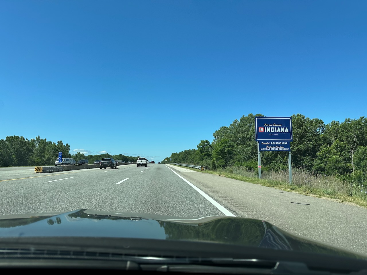 Welcome to Indiana roadside sign along highway. 