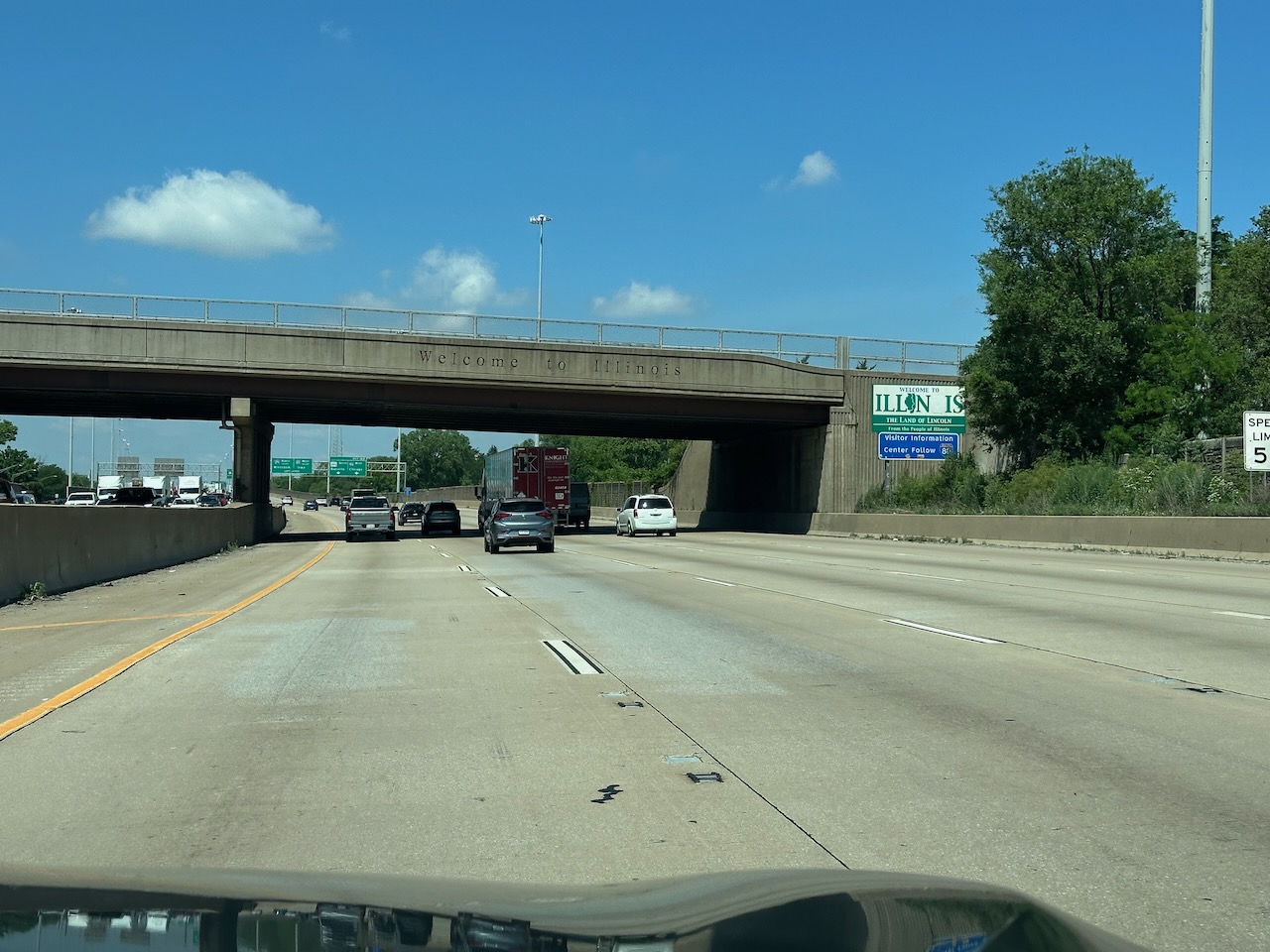 Welcome to Illinois sign on side of highway.