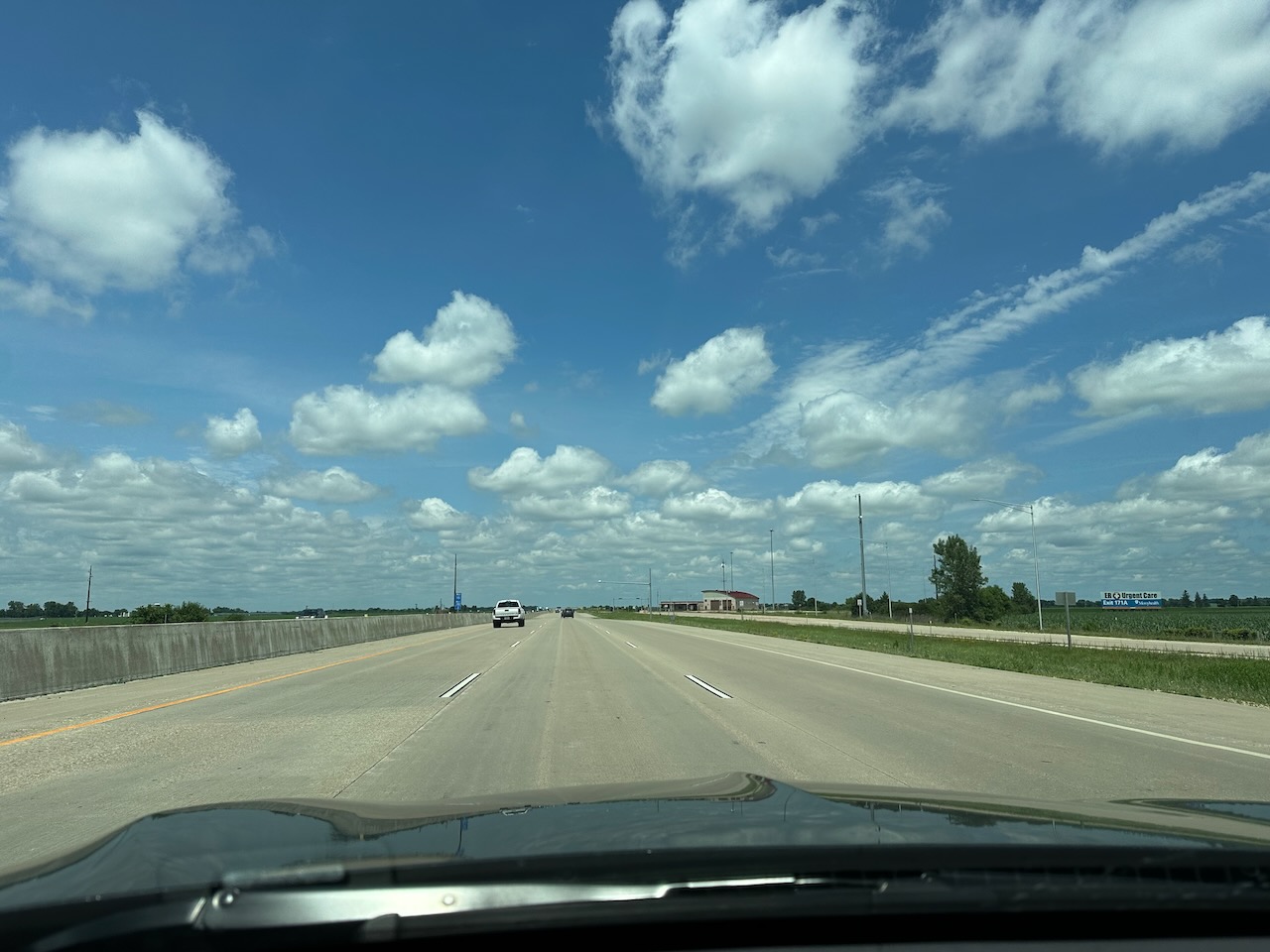View of I-94 under blue sky with clouds.