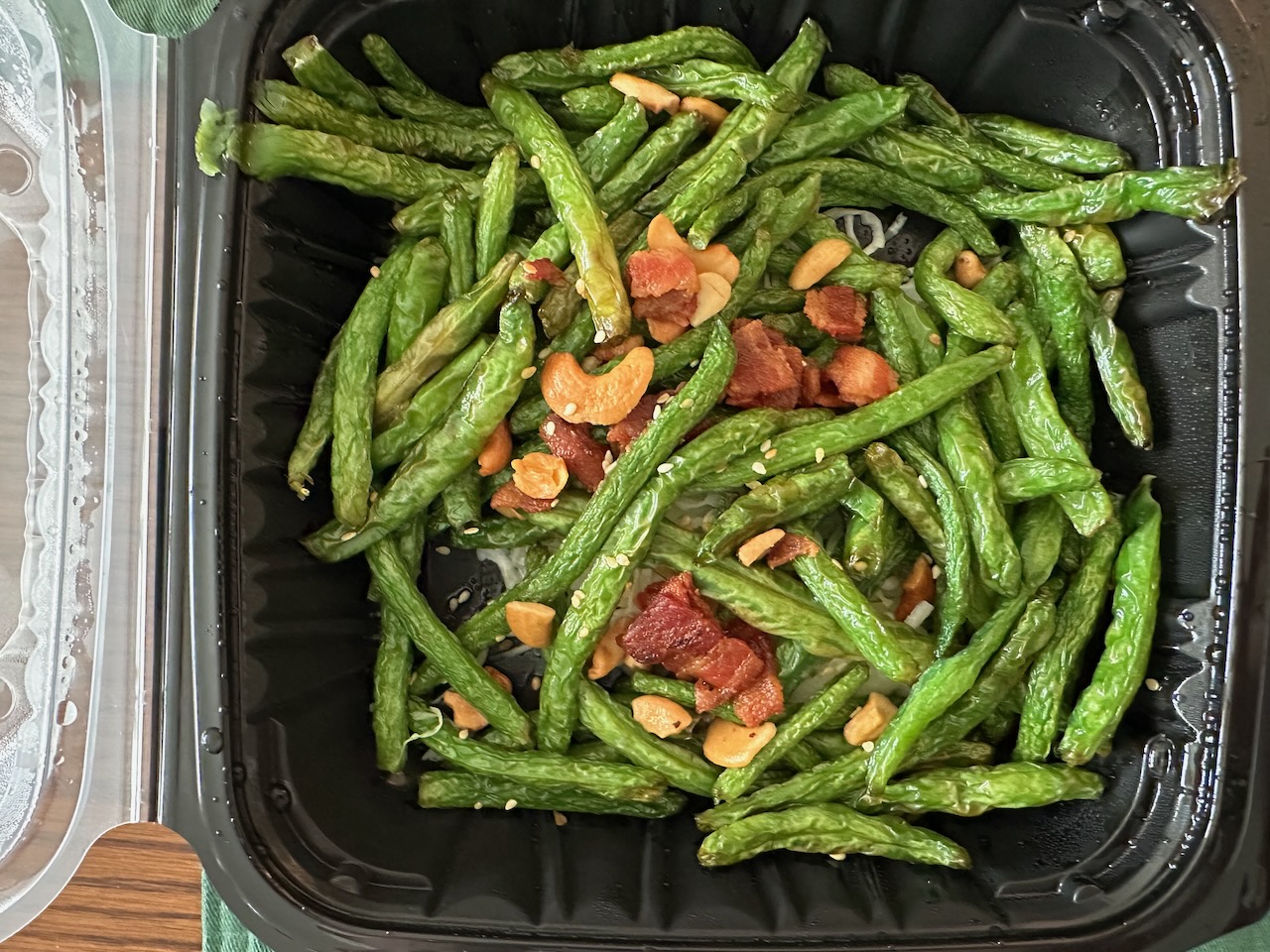 Takeout container with Szechuan Green Beans. 
