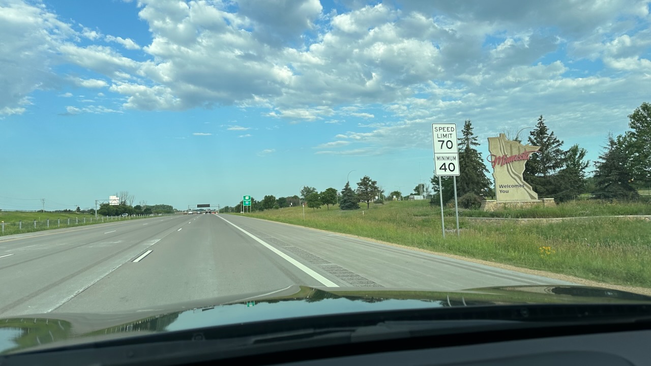 Welcome to Minnesota sign along side of highway.