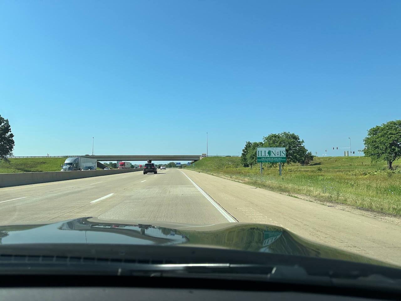 Welcome to Illinois sign on side of highway.