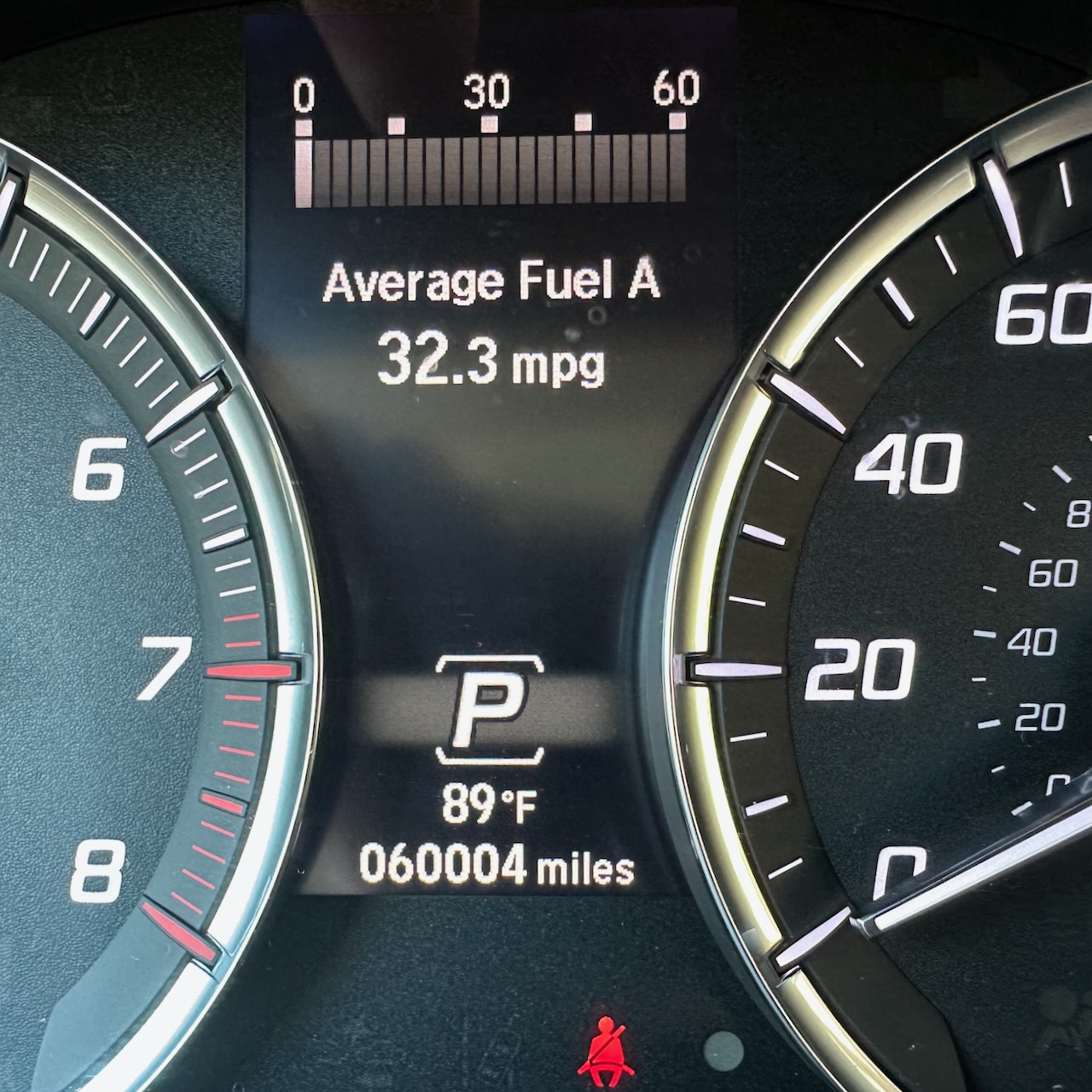 Car odometer reading 60004 miles.