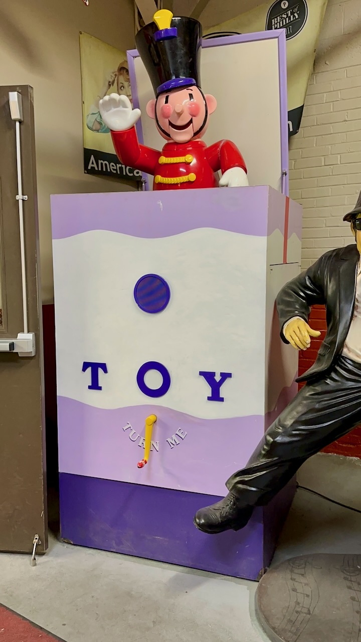 Kay-Bee Toys lifesize jack-in-the-box next to door.