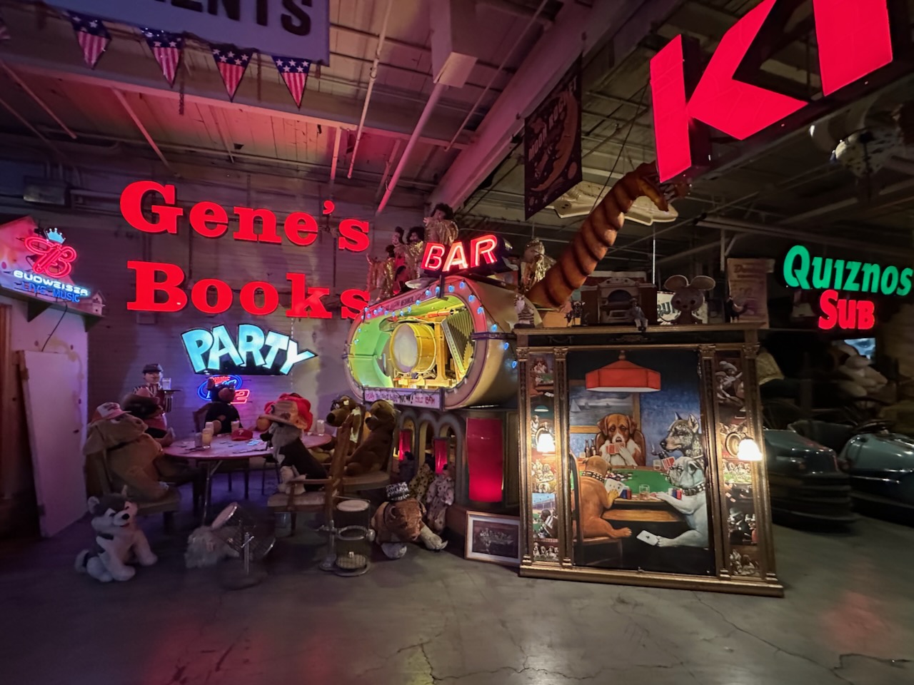 Painting of dogs playing poker with diorama of dogs playing poker.