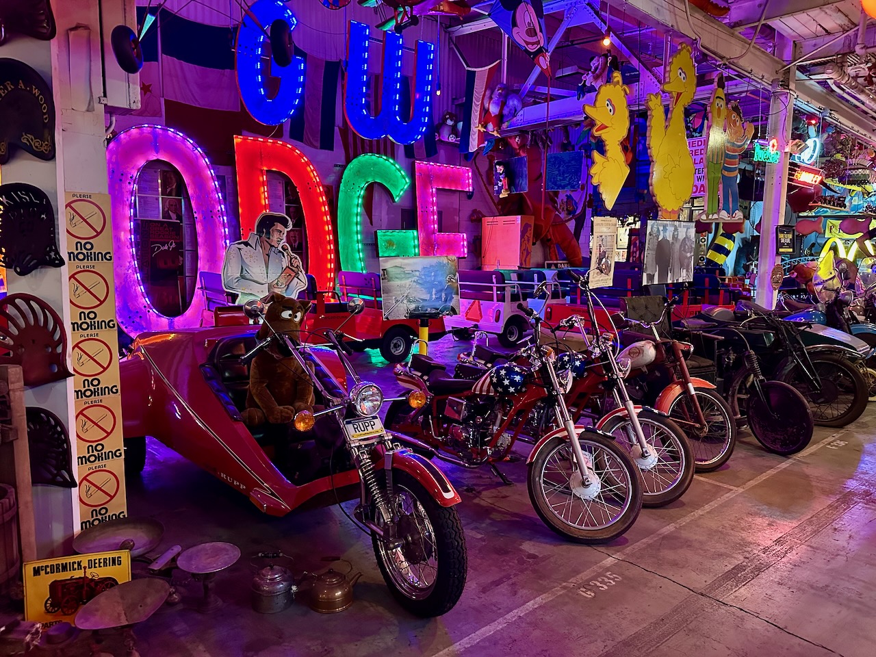Lineup of motorcycles with Rupp three-wheel motorcycle in foreground.