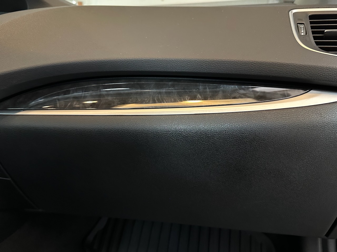 Glove compartment covered in new soft-touch material.