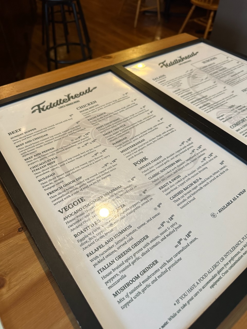 Menu for Fiddlehead bar and restaurant on counter.