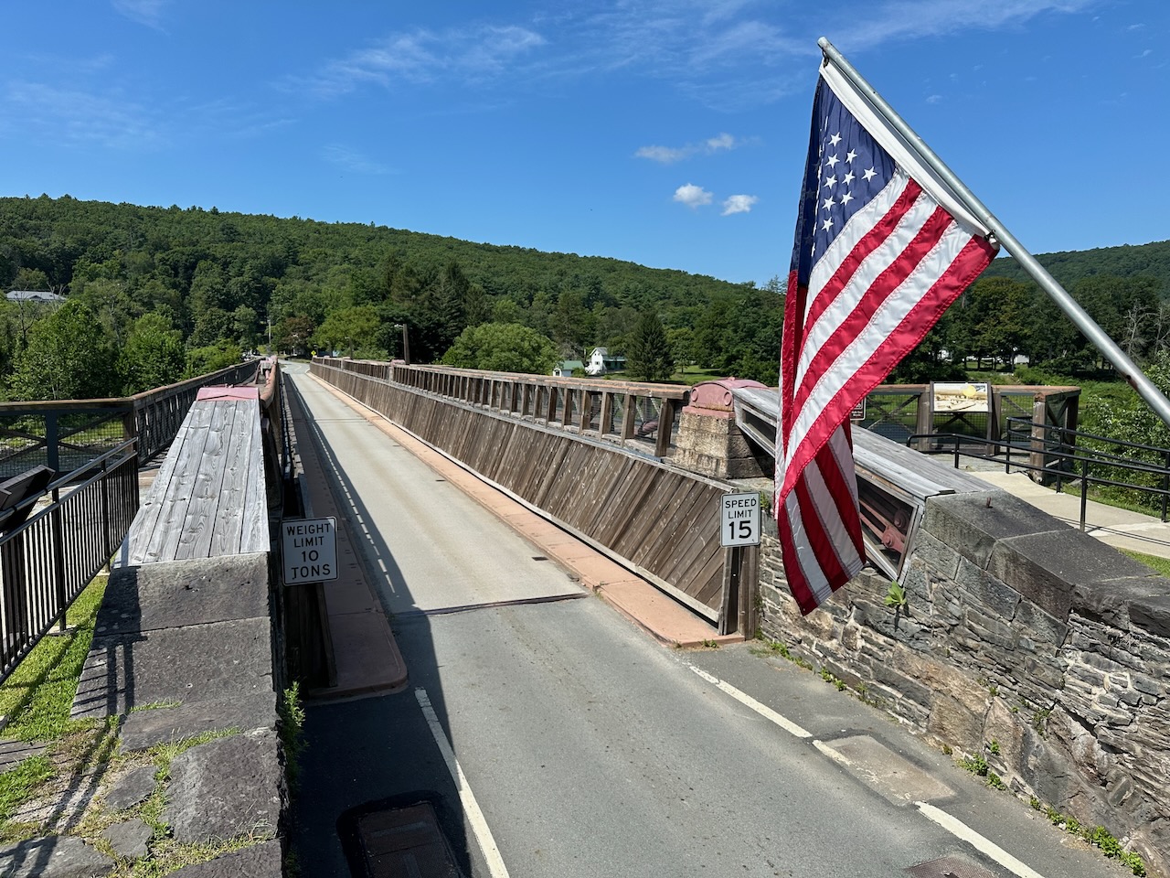 View of Roebling's Delaware Aqueduct. An American flag is in the foreground. 