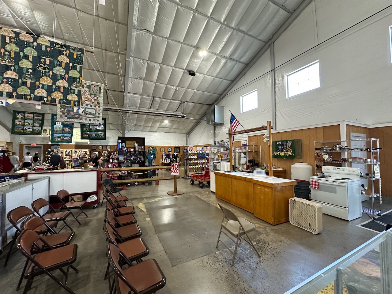 Mock kitchen set up with rows of chairs for classes.