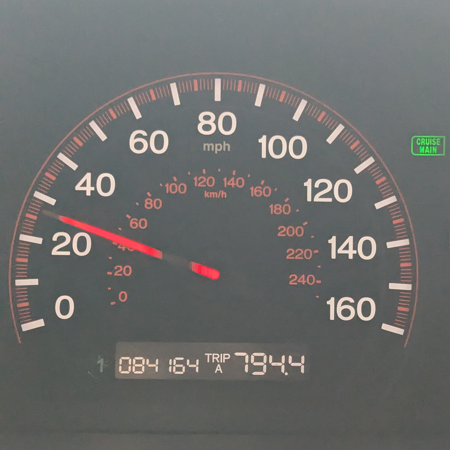 Car odometer reading 1,084,164 miles.