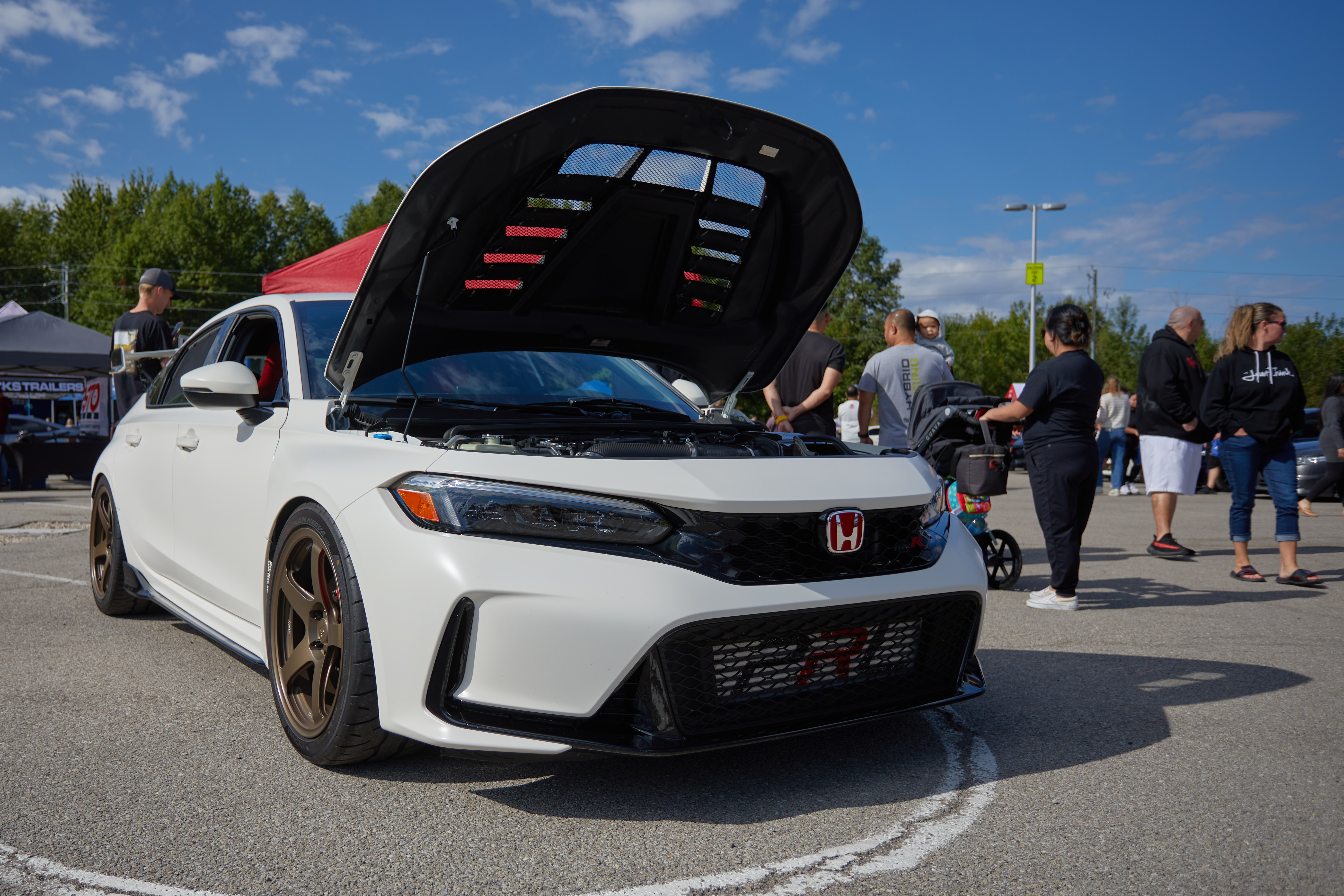 Honda Civic Type R, in white, with hood up.