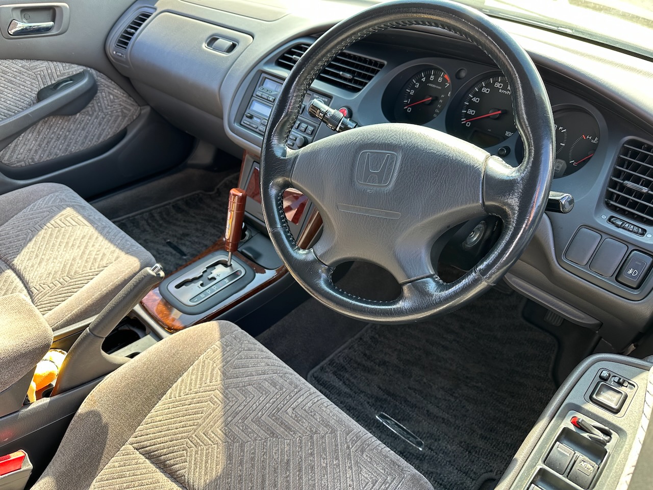 Interior of Honda Accord with steering wheel on right side.