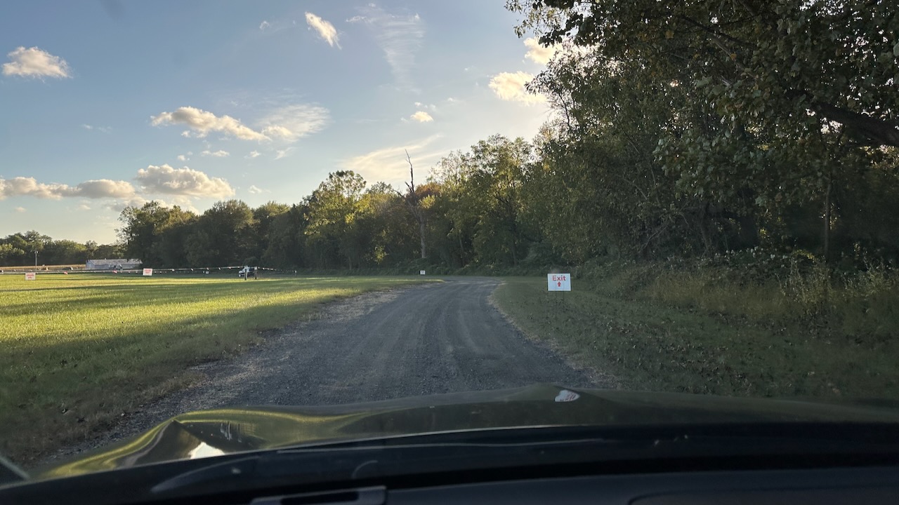 Gravel road viewed from behind dashboard of 2020 Acura TLX