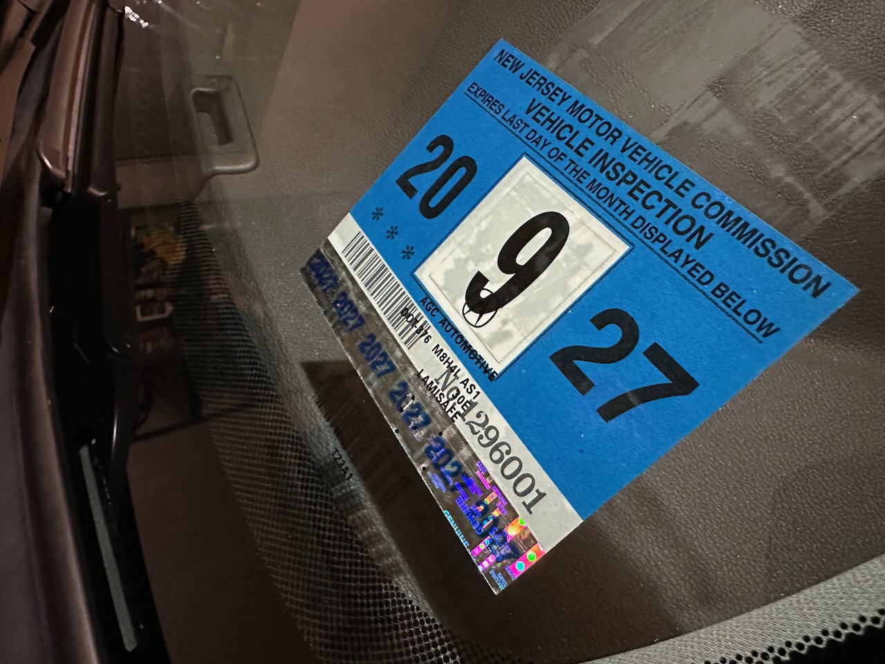 Inspection sticker on windshield of 2020 Acura TLX.