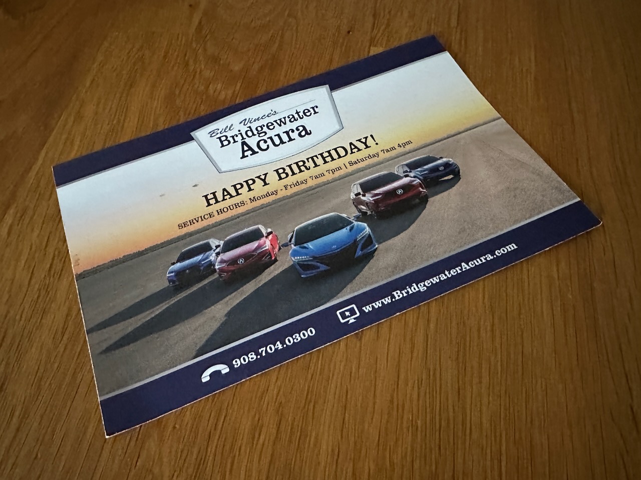 Mailer for Bridgewater Acura that has photo of various models of Acuras on it, along with Happy Birthday message.