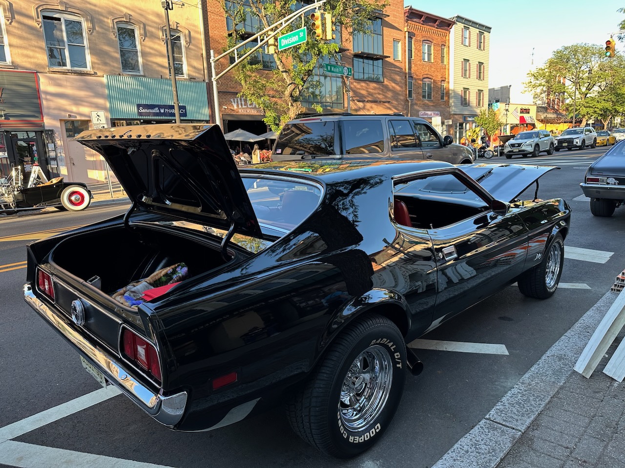1970s Chevrolet Camaro in black parked beside curb. 