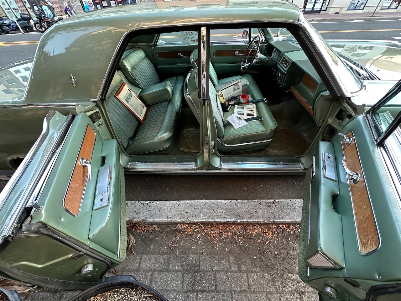 Open front and rear passenger doors of Lincoln Continental.