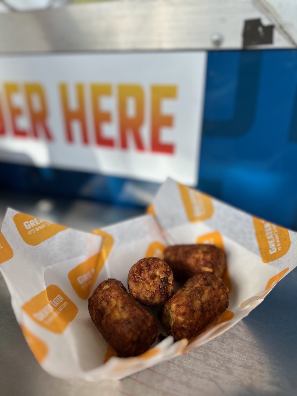 Four tater kegs in basket.