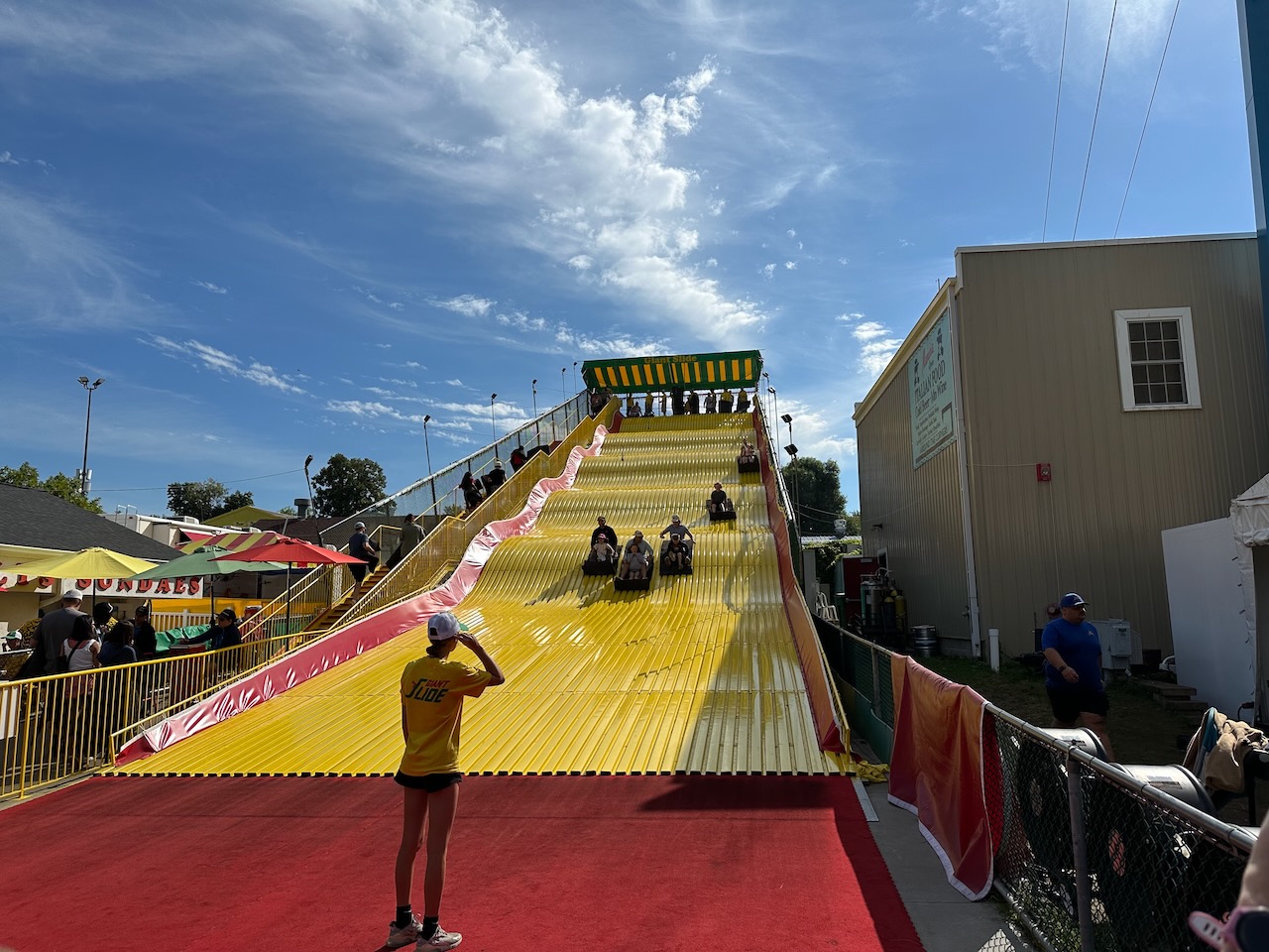 Giant Slide, with people sliding down on mats.