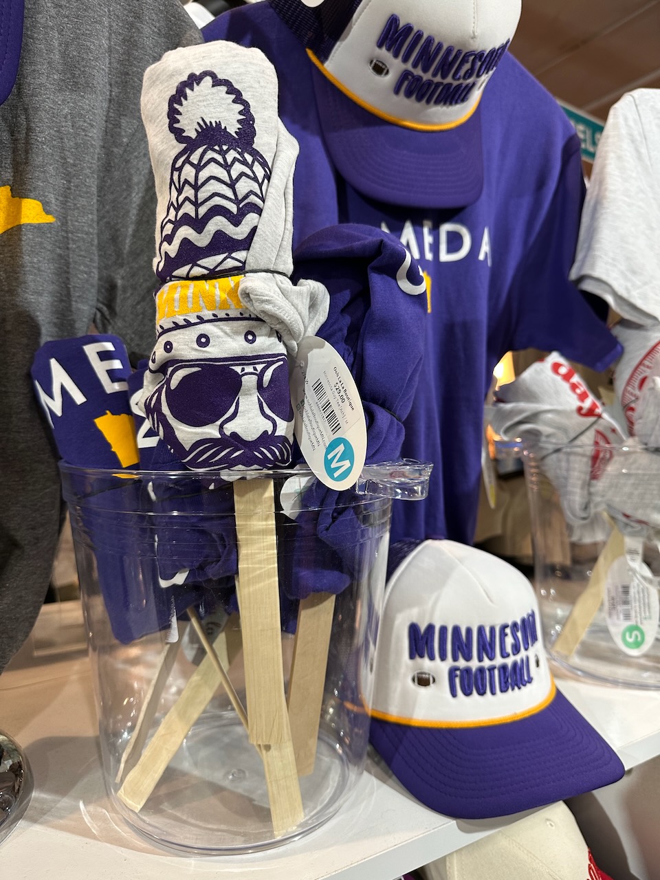 Display of souvenir hats and t-shirts.