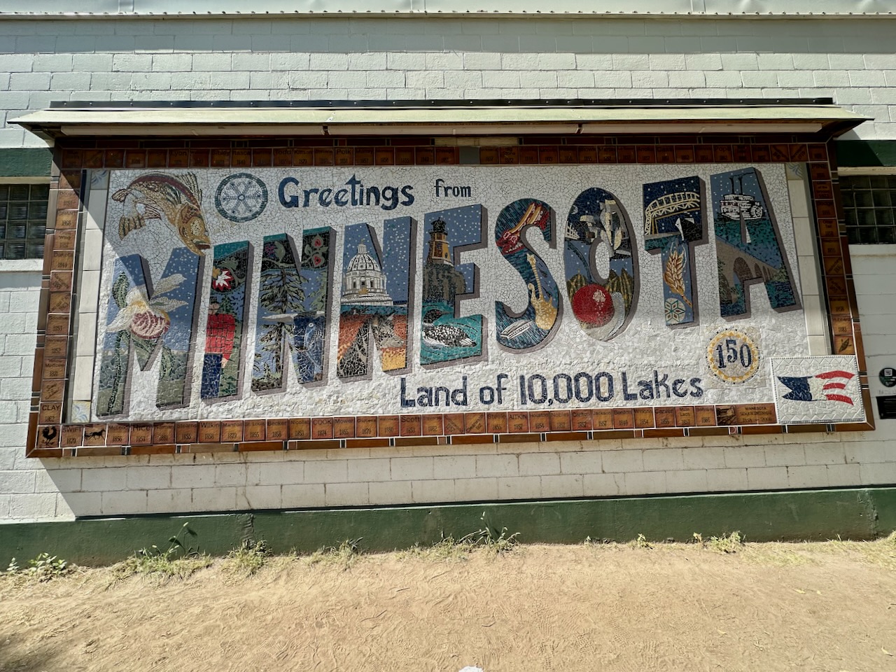Mosaic that says GREETINGS FROM MINNESOTA LAND OF 10,000 LAKES