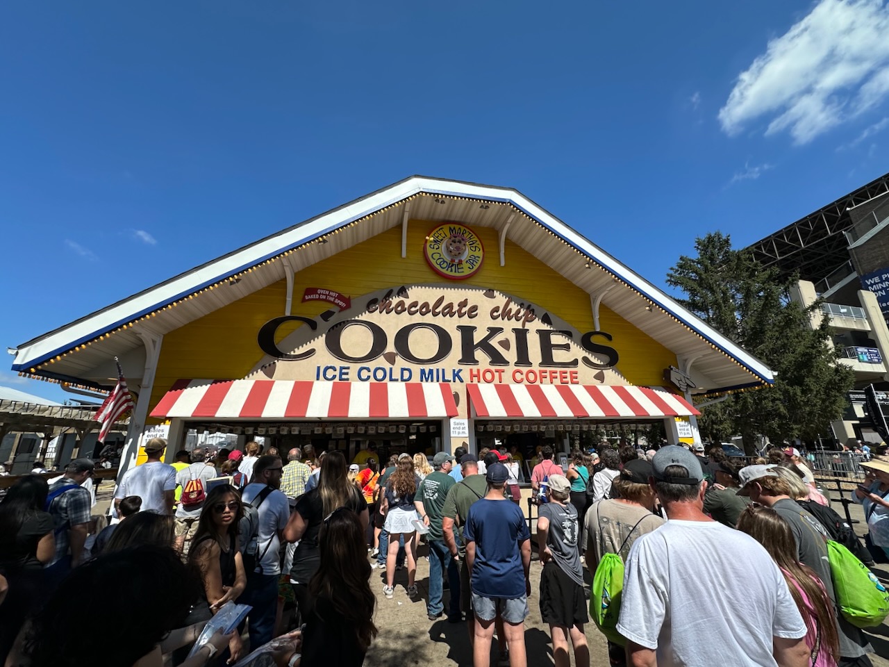 Exterior of Sweet Martha's Chocolate Chip Cookies stand, with lines of people waiting to order.