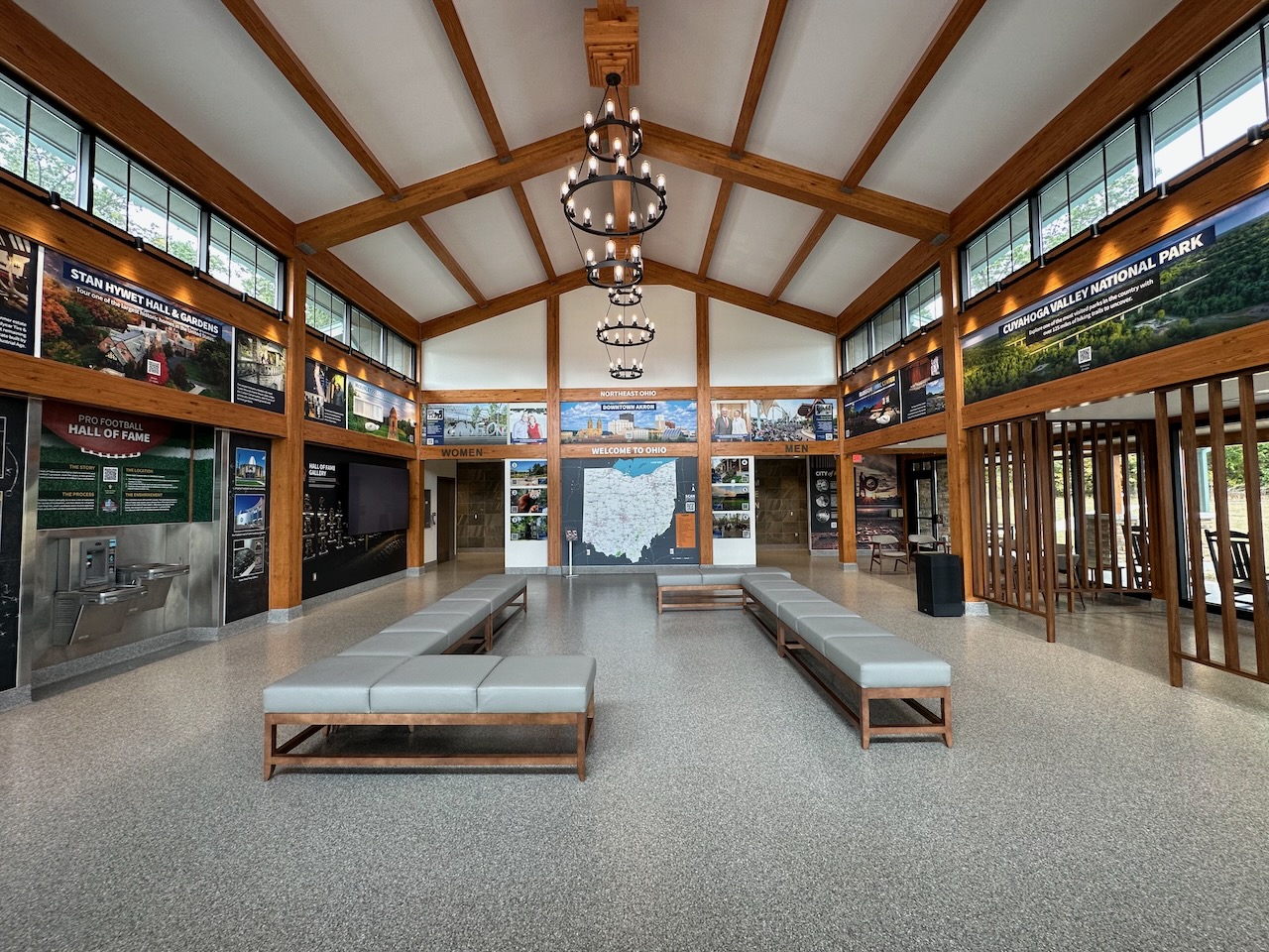 Interior of rest area with signage of area attractions on walls.
