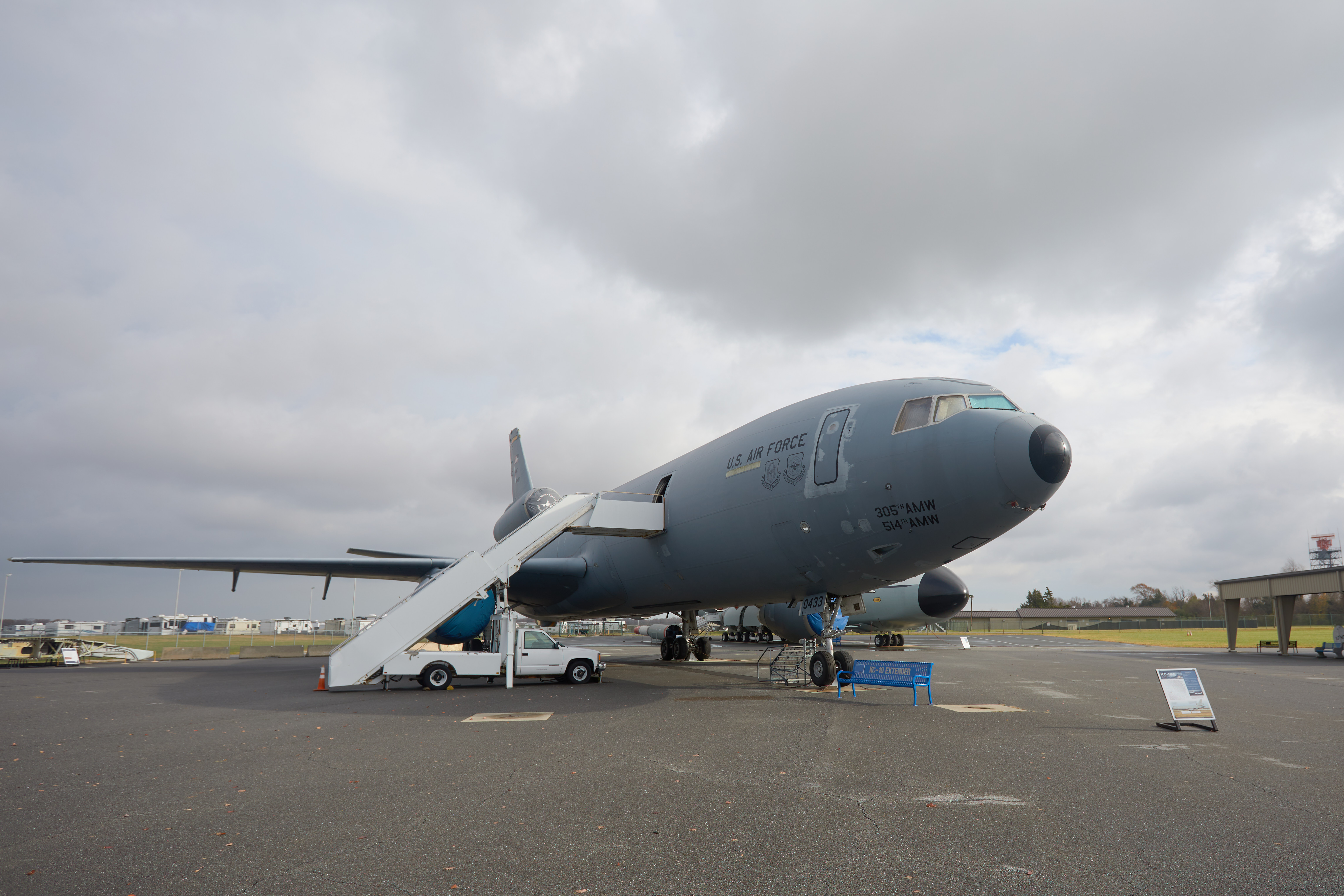 KC-135E Extender jet, with white staircase leading up to jet.