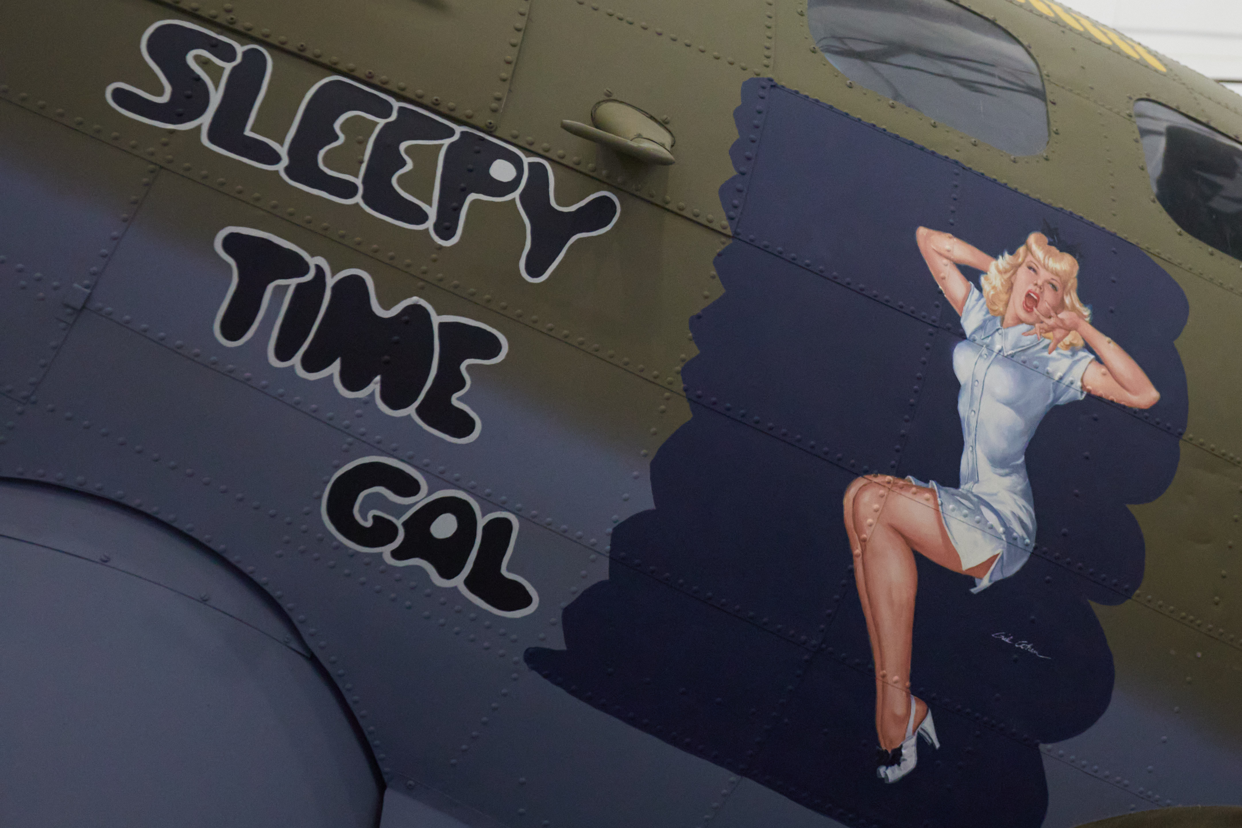 Nose art of Sleepy Time Gal on nose of B-17G.
