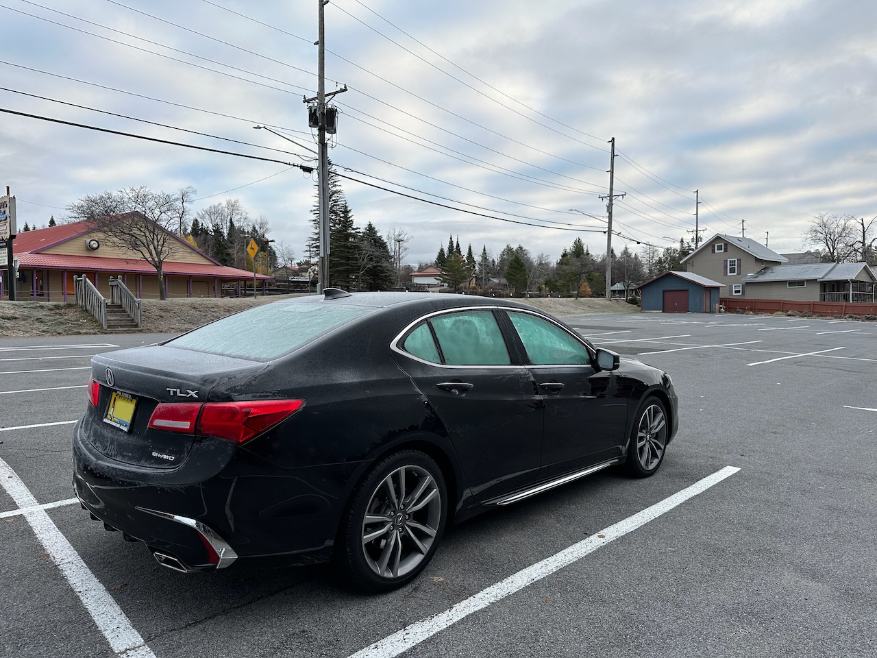 2020 Acura TLX in parking lot, covered in frost.