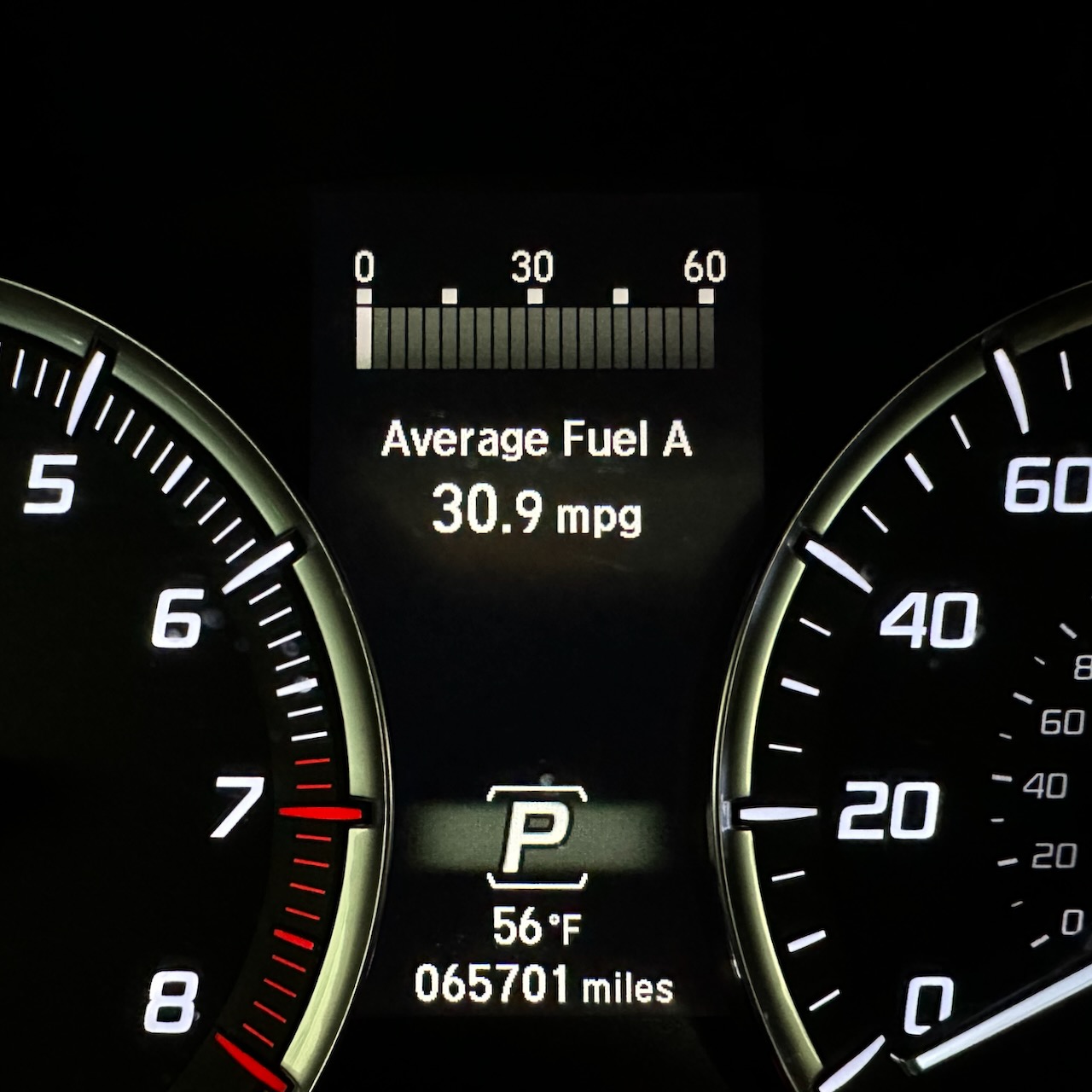 View of car odometer reading 65701 miles.