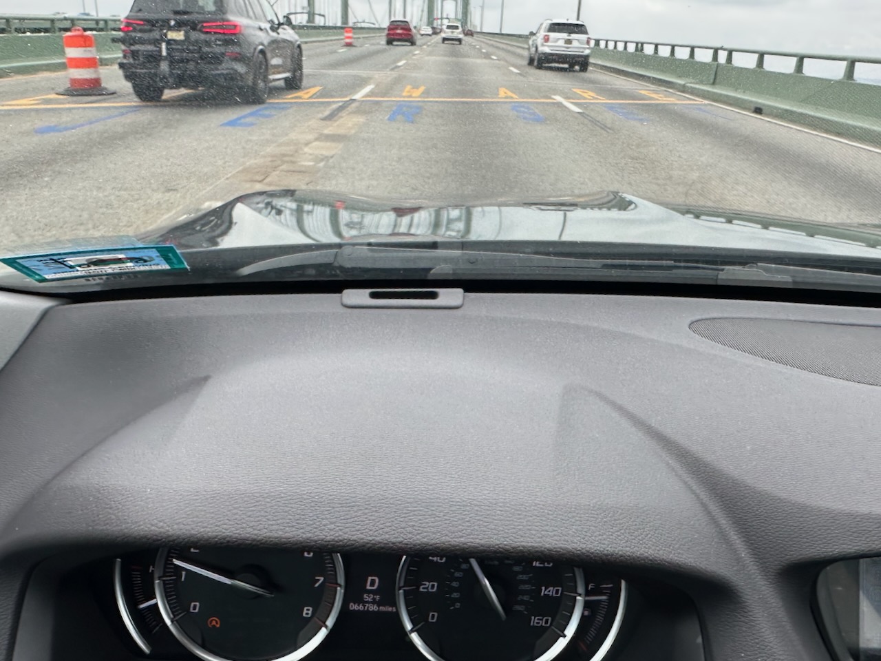 View of Delaware Memorial Bridge with New Jersey/Delaware State Line painted on bridge. 
