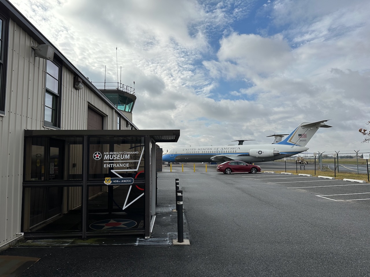 Entrance to Air Mobility Command Museum, with VC-9C aircraft on tarmac in background.