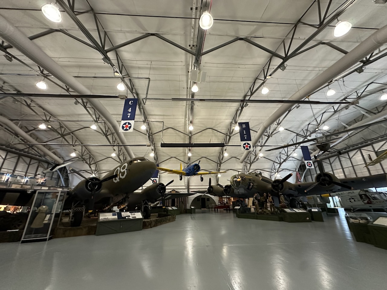 Hanger of museum displaying several aircraft. 