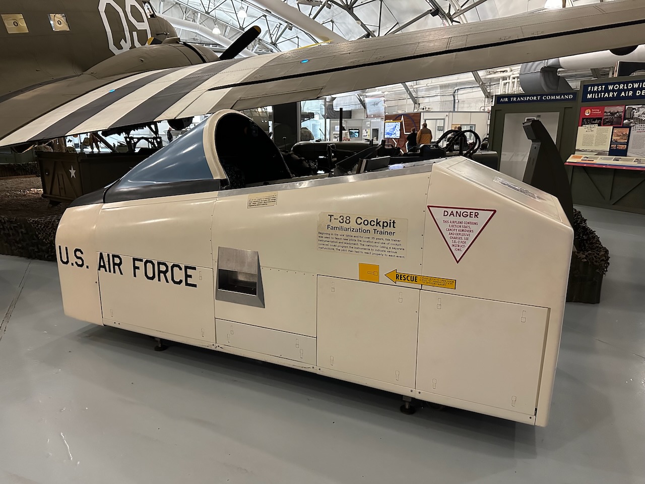 T-38 simulator on floor of hangar. 