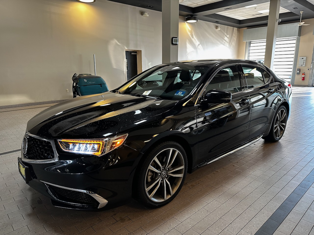 2020 Acura TLX in service drive-up garage of Acura dealer.