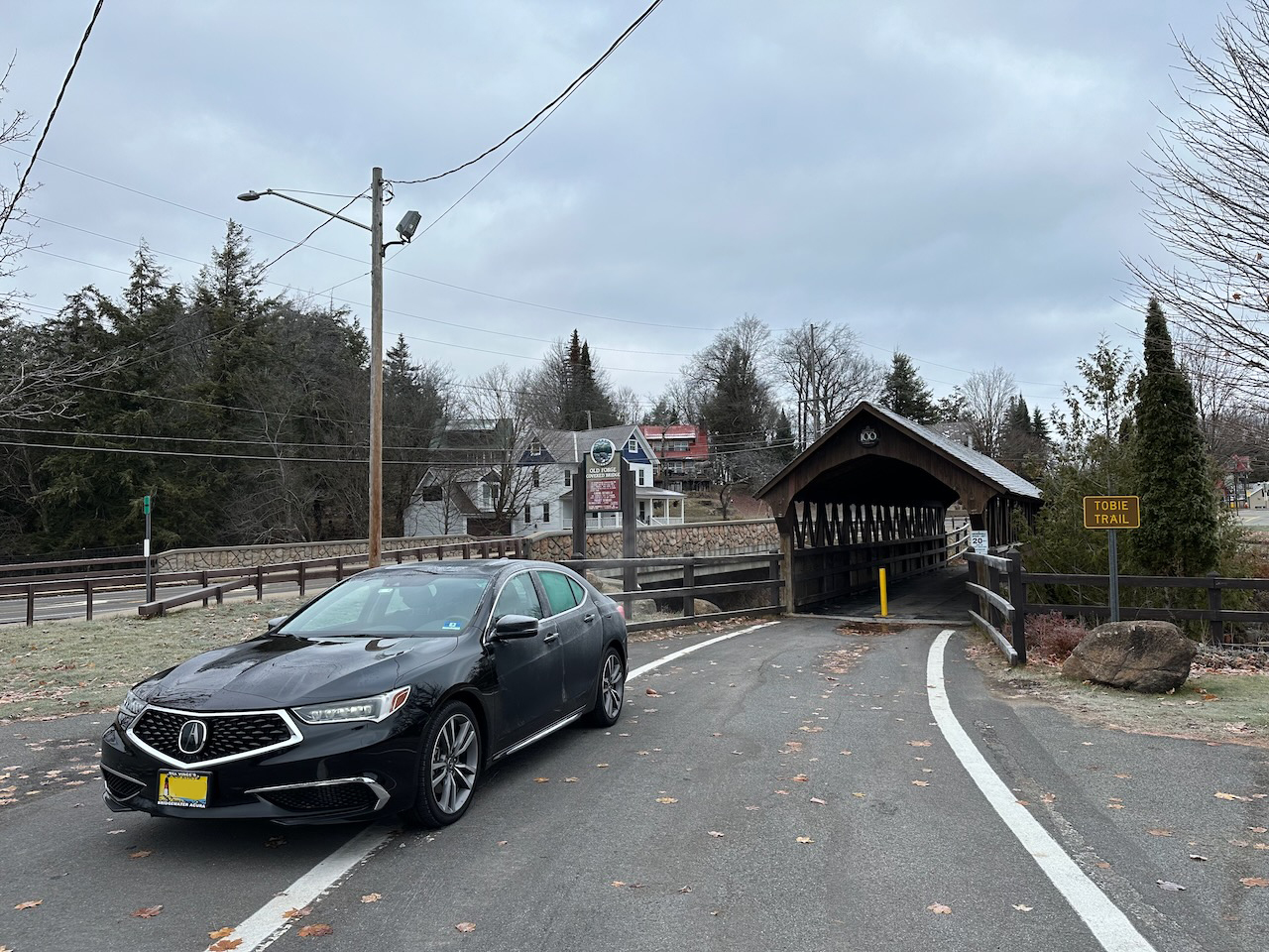 2020 Acura TLX parked in front of Old Forge Covered Bridge.