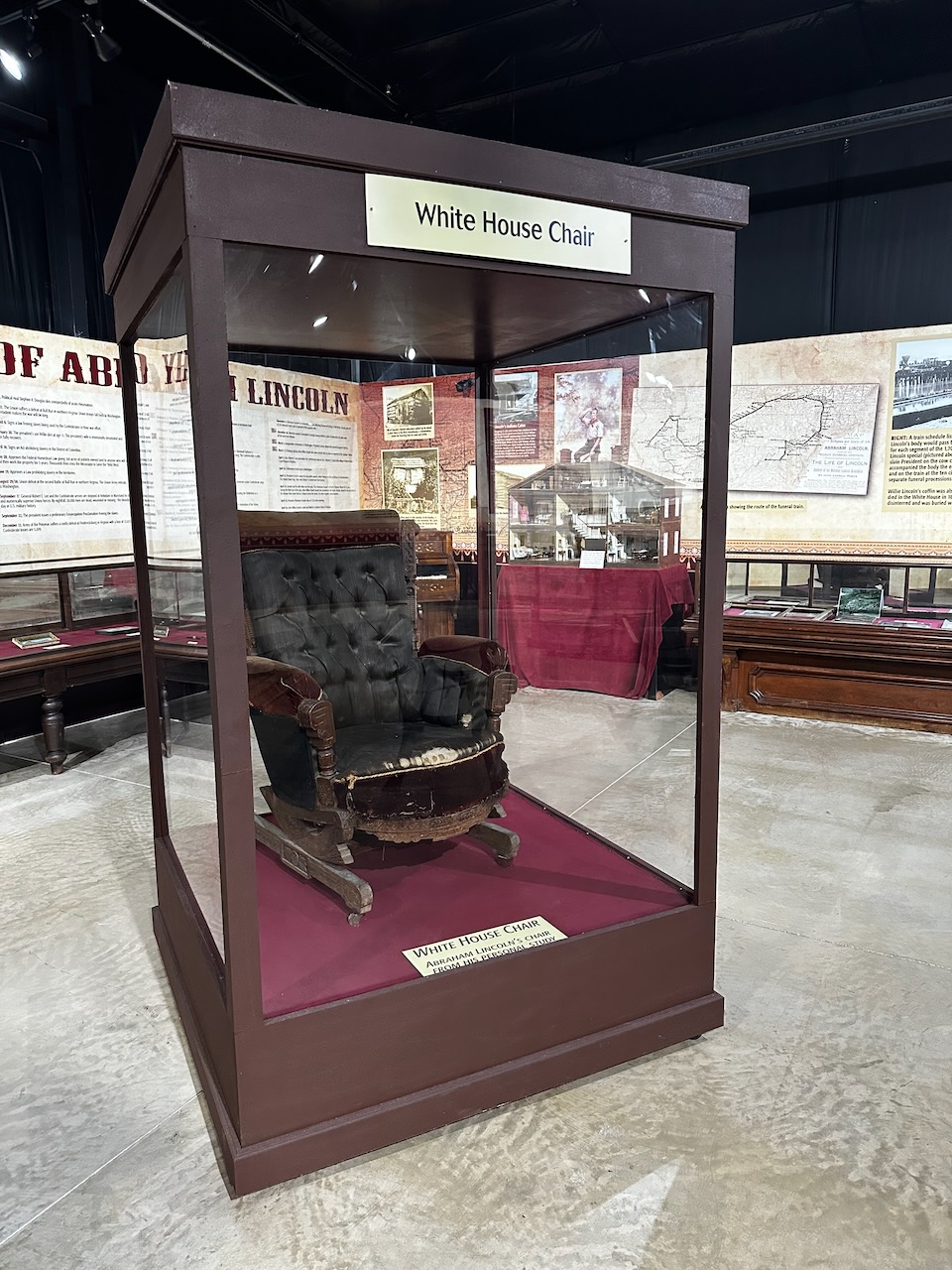 Chair in glass display case.
