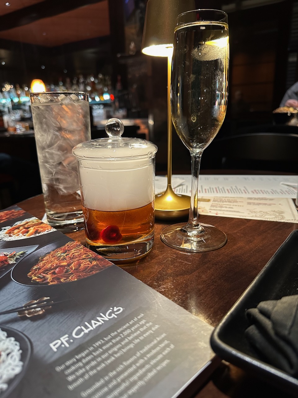 Menu and two drinks on table at PF Chang's.