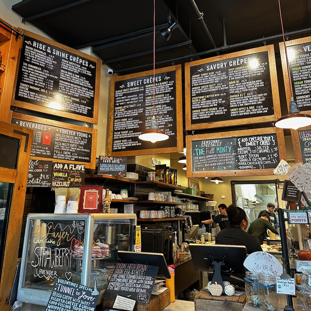 Chalkboard menu above register inside Jammin Crepes