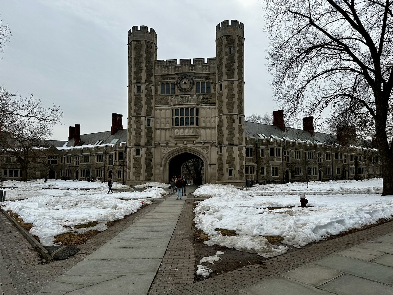 Blair Hall on a cloudy day with gray skies. Snow covers the grass.