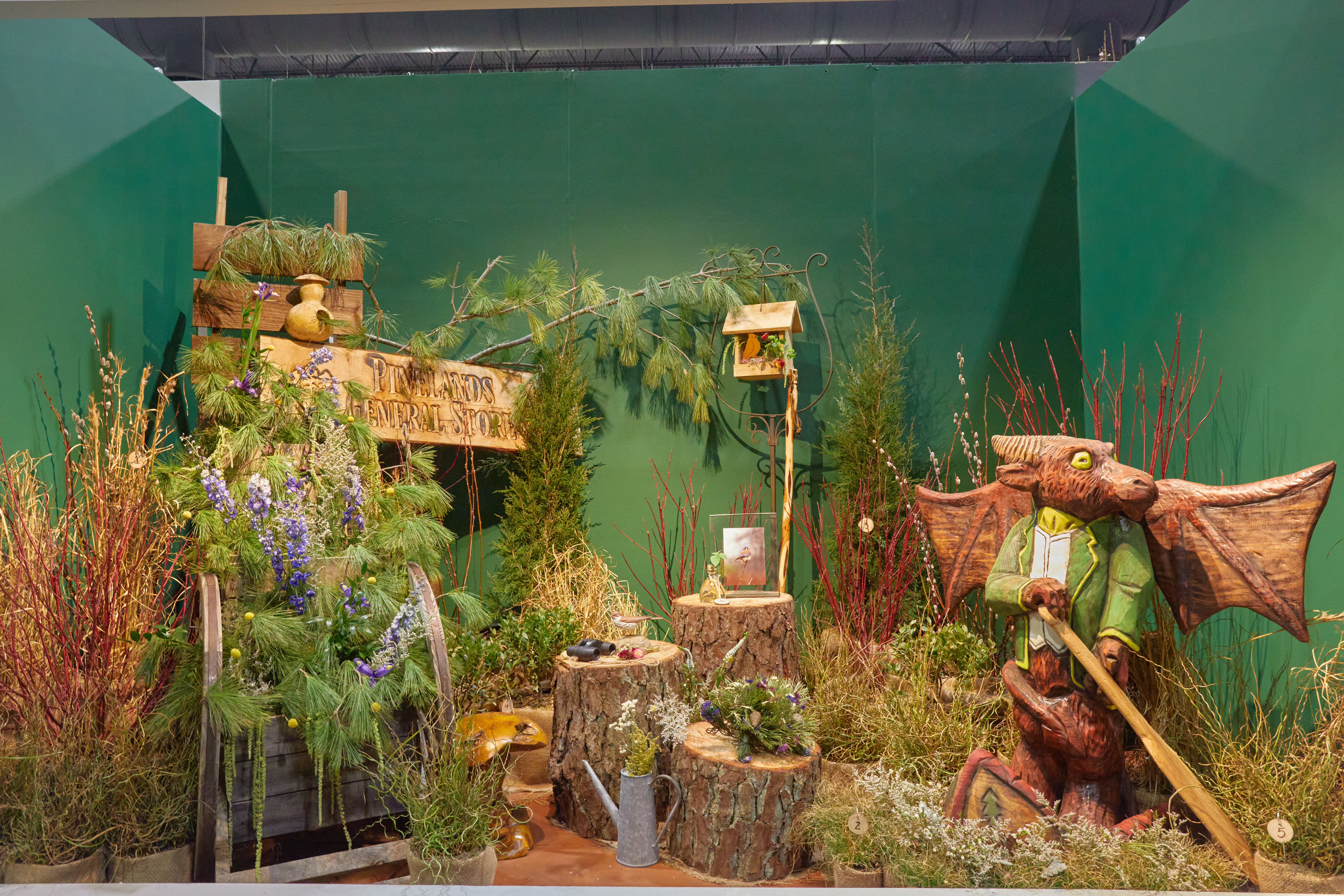 Exhibit of objects that represent the Pinelands, including a statue of the Jersey Devil.