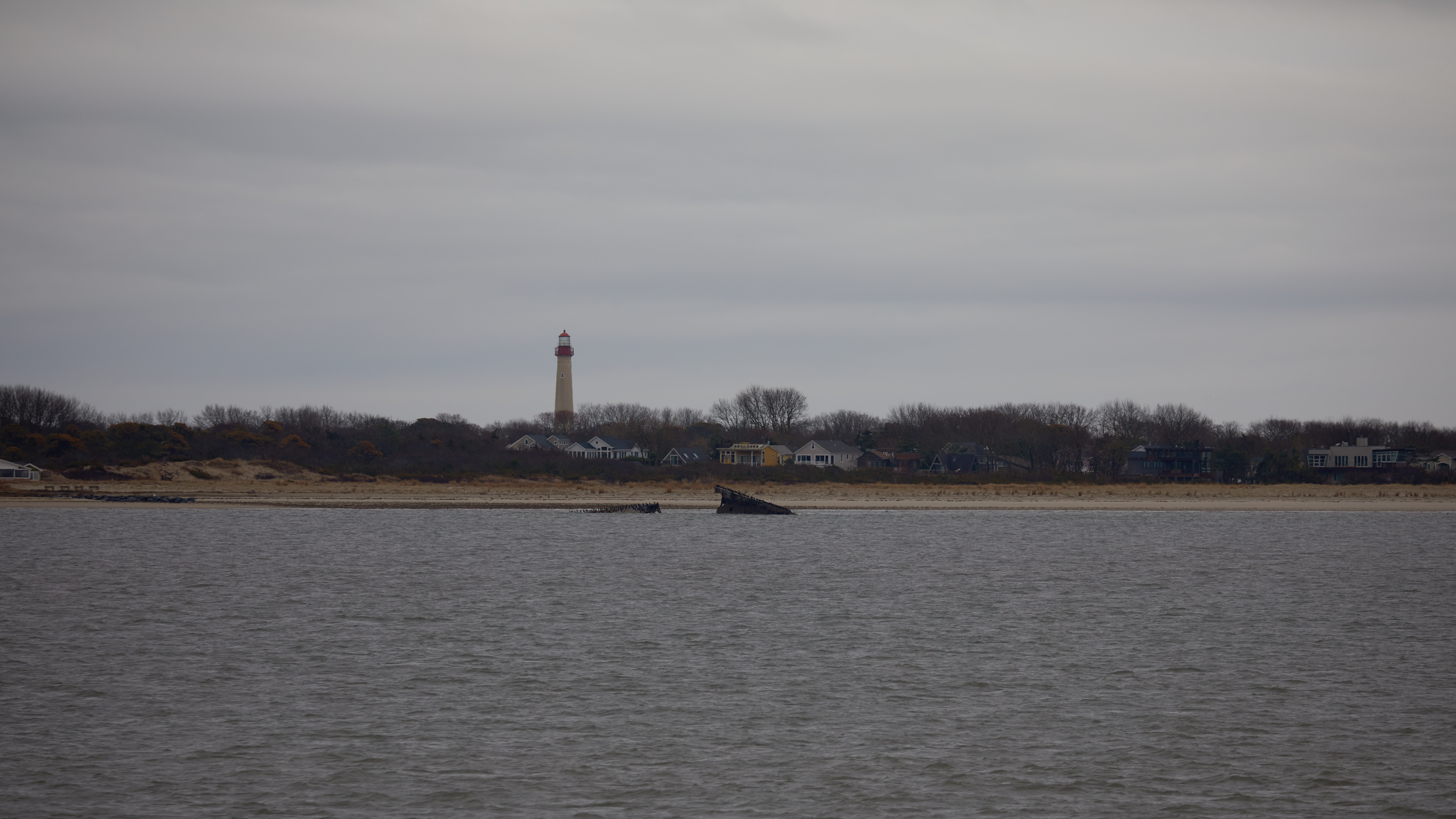 Cape May Lighthouse and Concrete Ship wreck along coast of New Jersey.