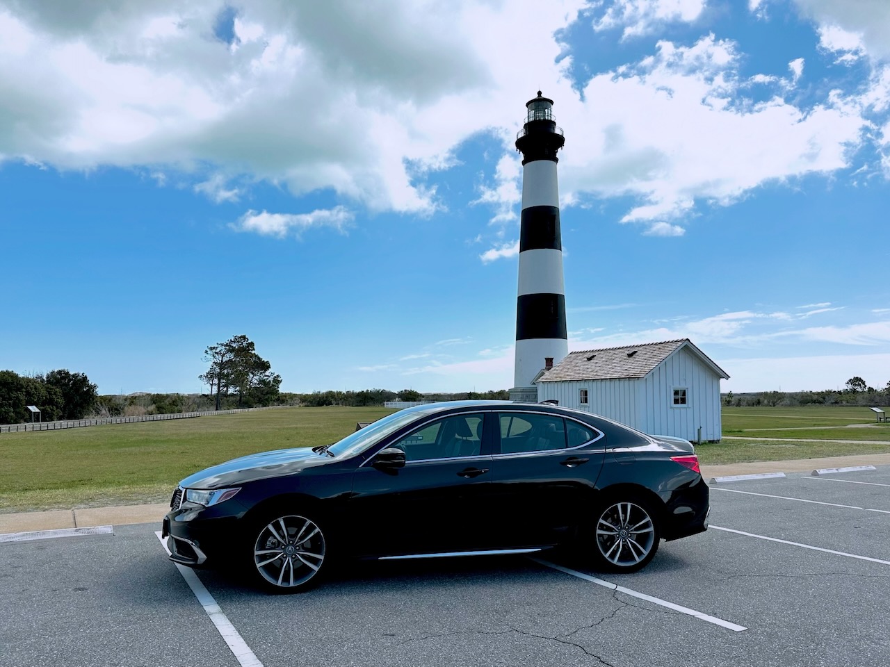 2020 Acura TLX parked in front of Bodie Island Light Station.
