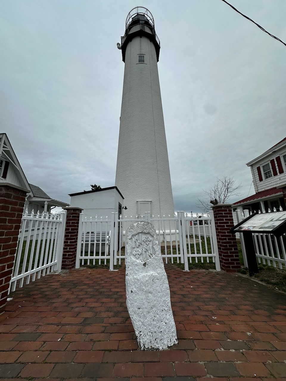 Stone marker in front of lighthouse.