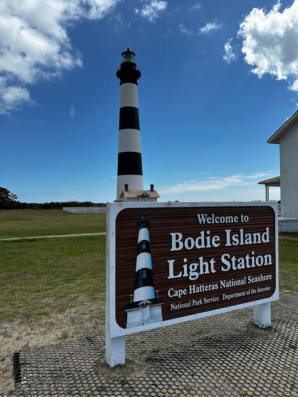 Bodie Island Light Station, with sign in foreground that says BODIE ISLAND LIGHT STATION.