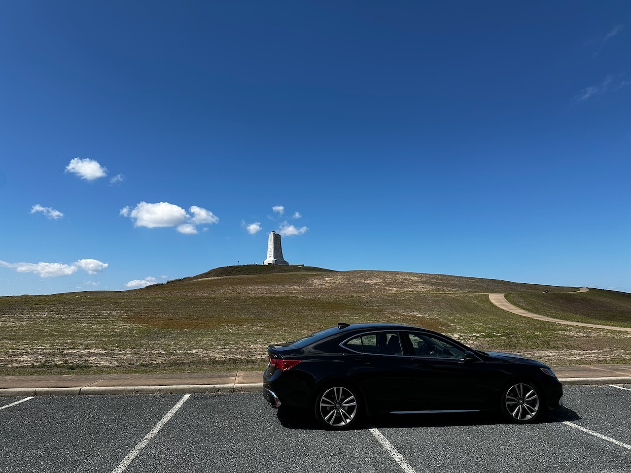 2020 Acura TLX parked at bottom of hill below Wright Monument.